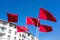 Moroccan flags against a blue sky in Morocco