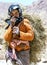 A Moroccan girl carrying a load of hay in the Todra Gorge at Tinerhir in Morocco.