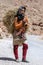 A Moroccan girl carrying a load of hay in the Todra Gorge at Tinerhir in Morocco.