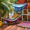 A Moroccan hammock corner with colorful hammocks, patterned pillows, and tasseled blankets5, Generative AI