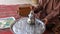 Moroccan man making tea at home