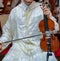 A Moroccan player wearing a djellaba plays a violin called Andalusian art in Morocco and Algeria.