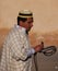 Moroccan snake charmer in hat with snake