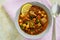 Moroccan soup harira with meat, chickpeas, lentil, tomato and sp