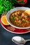 Moroccan soup harira with meat, chickpeas, lentil, tomato and sp