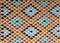 Moroccan Style Diamond-shaped pattern Bright Blue Orange Brown Color Tiled Wall in Fez, Morocco