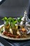 Moroccan tea with mint in traditional glasses, copper teapot on a copper plate