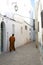 Moroccan walking through narrow alley