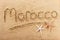 Morocco beach word writing message travel concept