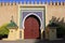 Morocco, Fez, Islamic wooden arched door and glazed tile surround