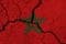 Morocco flag on the cracked earth