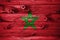 Morocco flag on wooden planks background