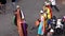 Morocco, Marrakech - October 2019: Local Arab berber street performers in bright multicolored clothes playing on drums