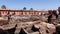 Morocco, Marrakech - October 2019: Workers on Traditional Leather Tannery removing leather from a soaking bath. View on