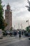 Morocco. Street with people in Marrakech with mosque Koutoubia Mosque in the background, in October 2019