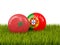 Morocco vs Portugal. Soccer concept. Footballs with flags on green grass