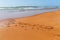 Morocco word is written on the sandy beach of the Atlantic ocean coast in Morocco