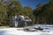 Moroka Hut camp site on a blue-sky day after a light dusting of snow