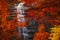 Morricana Waterfalls in Monti della Laga, Abruzzo, Italy, in the full autumn season with red and orange leaves