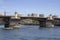 Morrison Bridge on a Sunny Summer Day on the Willamette River with speed boat in Portland Oregon