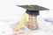 Mortarboard on british coins and pound sterling banknotes