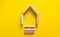 Mortgage investors symbol. Concept words `Mortgage investors` on wooden blocks near miniature wooden house. Beautiful yellow