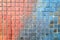 Mosaic brick tile wall, close up of graffiti texture, with vibrant colors.