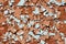 Mosaic of bunch of small broken kitchen tiles left at abandoned local construction site texture background wallpaper