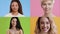 Mosaic collage of diverse smiling faces of successful female portraits over different colorful studio background