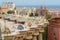 Mosaic colonnade at park Guell and skyline of Barcelona