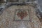 Mosaic with double-headed eagle on the floor in the St. Nicholas church dungeon in Bayt Jala - a suburb of Bethlehem in Palestine