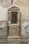 Mosaic lararium in house of the Skeleton in Ancient Ercolano (Herculaneum) city ruins