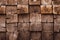 Mosaic of square bars, wooden planks. Brown slat, planch, bred wall. Vintage rustic close-up wood texture. Modern geometric patter