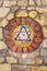 Mosaic star of David on stone wall