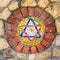 Mosaic star of David on stone wall