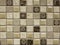 Mosaic tile of brown and beige squares of different tones