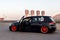 Moscow. Autumn 2018. Black Volkswagen Golf tuning. Air suspension, orange wide wheels and polish rims. Lowrider. Stance style. On