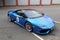 Moscow. Autumn 2018. Bright blue Lamborghini Huracan parked on the street. With red stripe on a car hood. Headlights and front