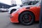 Moscow. Autumn 2018. Orange Porsche 911 GT3 RS On the parking, Racing supercar wheel and wings with air intake close up