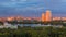 Moscow city skyline at sunset , panoramic view. Amazing colourful scenery of the park, river with yachts, sunlit buildings.