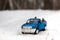 Moscow. December 2018. Blue toy Pickup truck Ford F350 with open door. Standing on winter snowy road. Forest on background