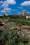 Moscow Kremlin on the background of stones and northern vegetation.