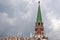 Moscow Kremlin. Color photo. Trinity tower and old wall made of red bricks.