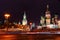 Moscow Kremlin night. St. Basil`s Cathedral and Spasskaya tower on the background of traces of car headlights