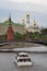 Moscow Kremlin panorama. Cruise ships sails on the river.