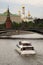 Moscow Kremlin panorama. Cruise ships sails on the river.