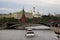 Moscow Kremlin panorama. Cruise ships sails on the river.