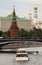 Moscow Kremlin panorama. Cruise ships sails on the river.