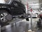 MOSCOW, MAR,02, 2017: Car automobile wheel alignment maintenance works repair at automotive service center workshop. Technical mai