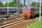 MOSCOW, MAY, 18, 2018: View on railway maintenance workes group between trains. Russian railways people at work in orange vests